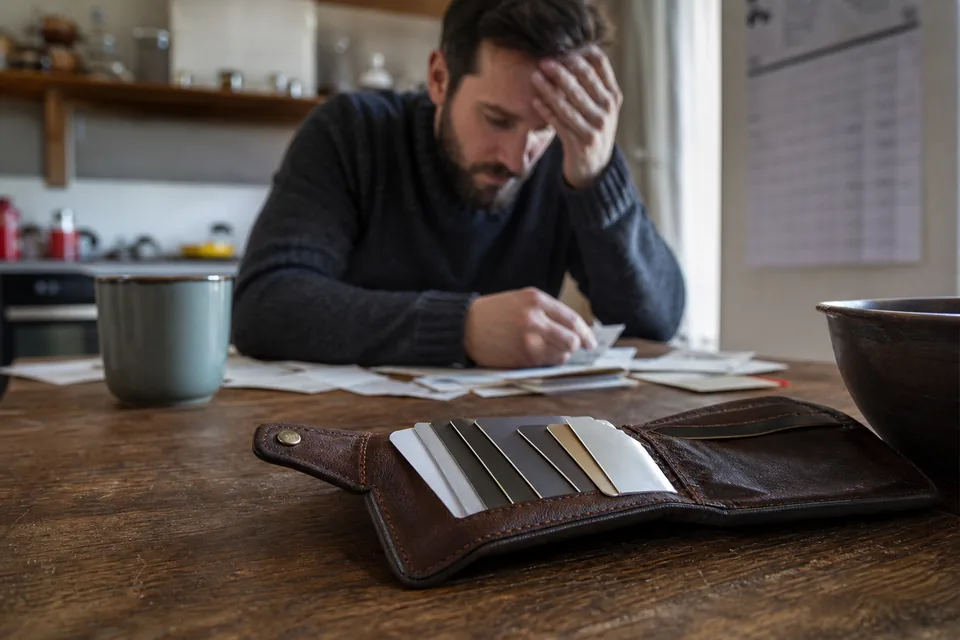 Open wallet with payment cards on a table