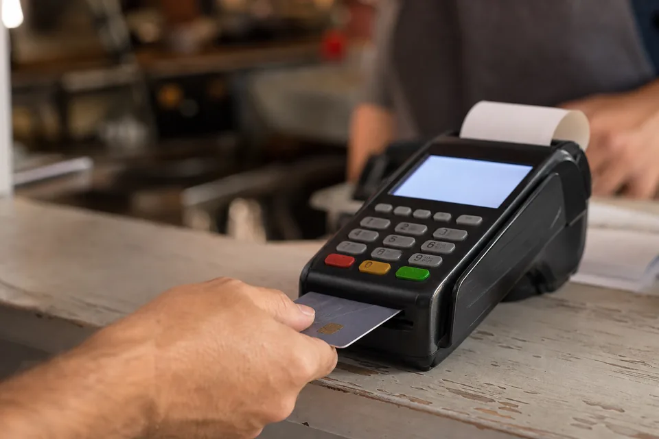 Card payment terminal on a shop counter
