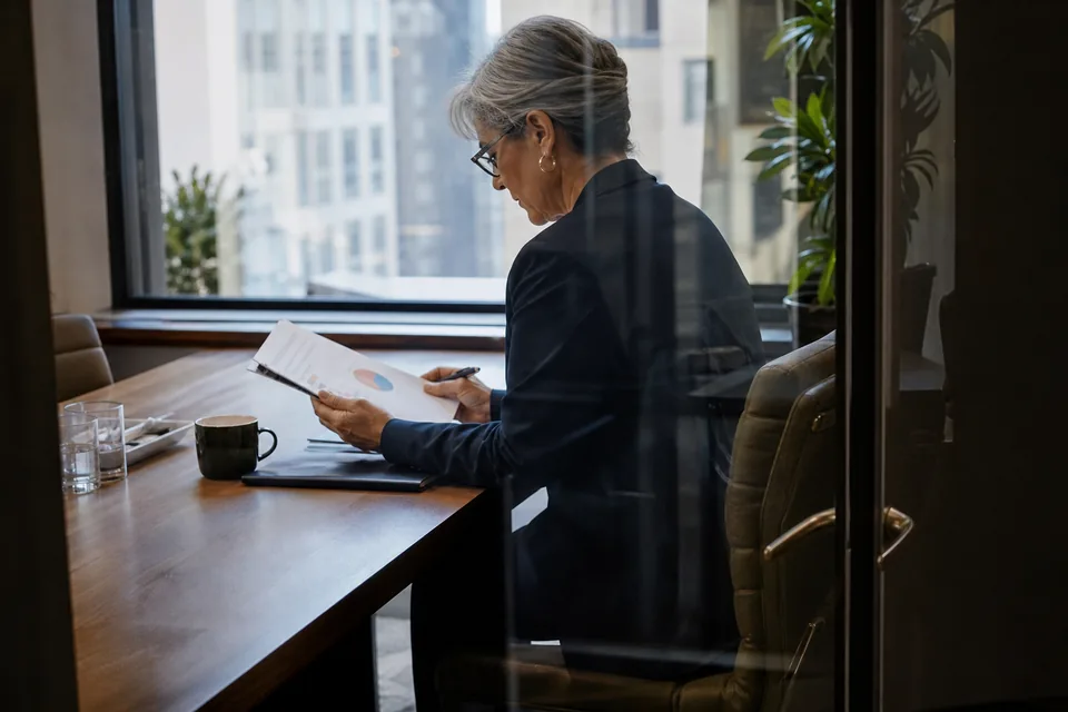 CFO reviewing a bound monthly report